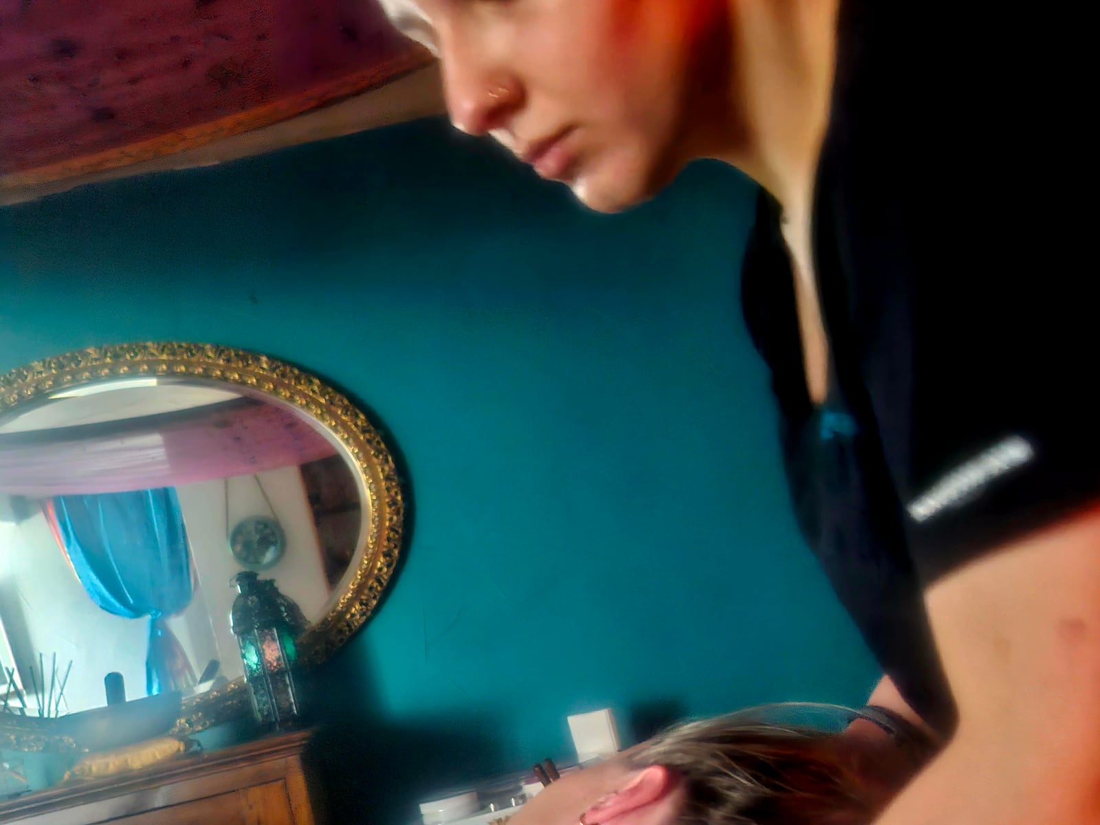 A Maiaveda therapist leaning over a guest on the treatment table
